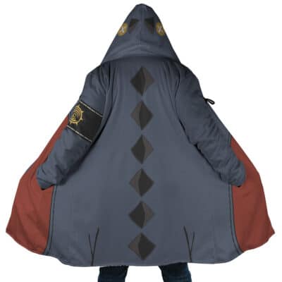 A person wears the Jabber Wonger Cosplay Gachiakuta Dream Cloak Coat (Copy), featuring a hood, gray and red colors, black diamond patterns down the back, an emblem on the left sleeve, and extends their arms to display its design.