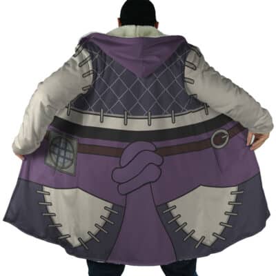 A person faces away from the camera wearing the Enjin Cosplay Gachiakuta Dream Cloak Coat, which features a cartoon-style back design with a large purple hand gesture, grey stitching, a belt, and a grid pattern near the shoulders.