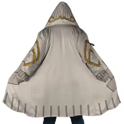 A person wearing the Guita Hebby Fantasia Cosplay Gachiakuta Dream Cloak Coat (Copy) in light gray, featuring gold and black geometric designs, stands with the cloak spread open, displaying detailed patterns on the arms and edges.