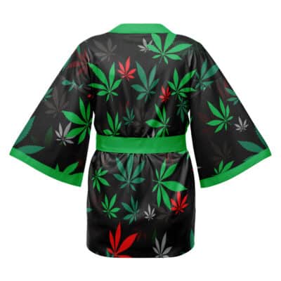 The Tekkadan Iron Blooded Orphans Mobile Suit Gundam Happi Coat Haori Kimono features a black design with green trim and a pattern of green, red, and white marijuana leaves, shown from the back with wide sleeves and a sash.