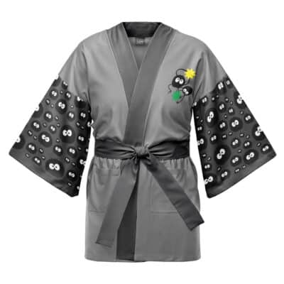 The Princess Mononoke Studio Ghibli Happi Coat Haori Kimono is gray with a black sash, featuring cute soot sprite faces on the sleeves and a soot sprite holding a green leaf and yellow star on the chest.