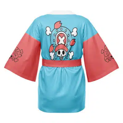 The Strawhats Luffy One Piece Happi Coat Haori Kimono features a blue and pink kimono-style design with wide sleeves, a cartoon skull with pink hat and crossbones on the back, and smaller logos on the sleeves.