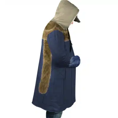 Someone stands in profile against a white background, wearing the Kuzan Timeskip Cosplay One Piece Dream Cloak Coat—a long blue coat with brown faux fur trim and a large beige hood, hands in pockets and looking down.