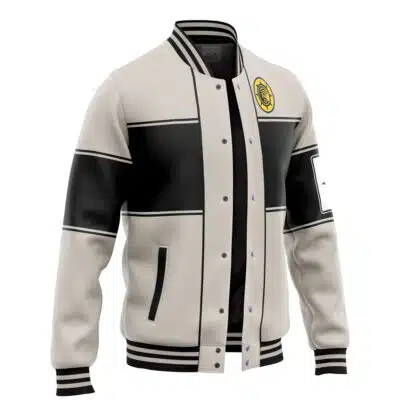 The Default Varsity Jacket (Copy) features a cream and black varsity style, black geometric panels, striped cuffs and hem, a yellow chest patch, a rectangular sleeve patch, and front buttons.