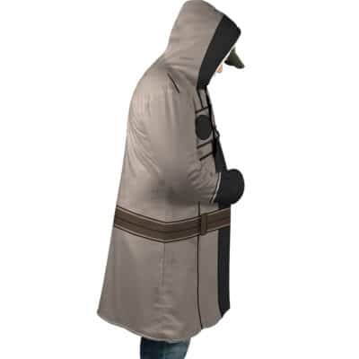 A person stands in profile with hands in pockets and head slightly bowed, wearing the Cid Kageno Shadow Cosplay The Eminence in Shadow Dream Cloak Coat, featuring brown printed belts and black costume-inspired accents.
