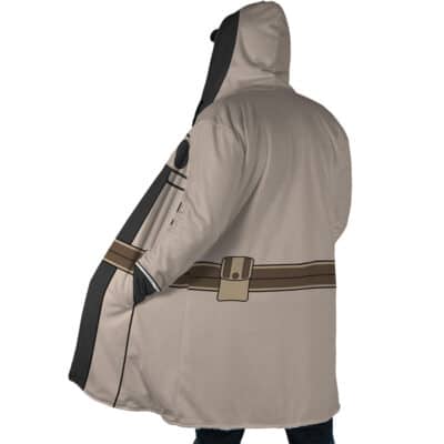 Someone wearing the Cid Kageno Shadow Cosplay Dream Cloak Coat, featuring a light brown hood, cartoon-print belt, and back pockets, stands with their back to the camera.
