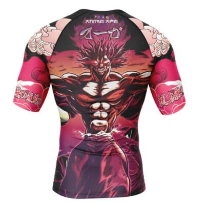 The Johnny Joestar Anime Jojo’s Bizarre Adventure Steel Ball Run Short Sleeve Rash Guard Compression Shirt showcases bold anime art of a powerful character with spiky hair, glowing eyes, Japanese text, and stylish patterns in red, black, and pink.