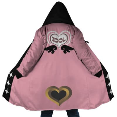 A person wearing the Belle Vibrant Store Manager Zenless Zone Zero Dream Cloak Coat: a pink hooded coat with black sleeves, heart and wing designs, "IDOL" inside a heart on the back, black wings, and a large gold/black heart near the bottom.