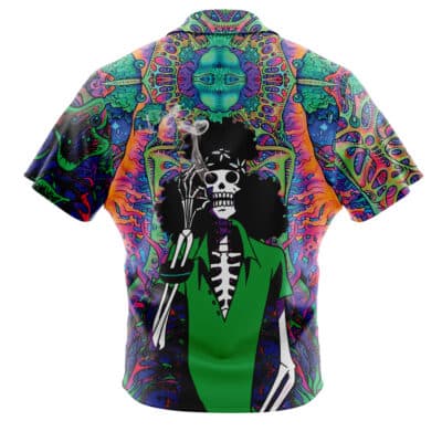 The Default Button Up Hawaiian Shirt (Copy) showcases a skeleton in a green jacket with a lit cigarette, set against psychedelic vibrant patterns and a surreal face in the background.