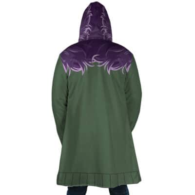 A person is seen from the back wearing the Shinigami Death Seal Shippuden Dream Cloak Coat, featuring a green hood, purple flame design across the shoulders and hood, and black trim details near the bottom hem.