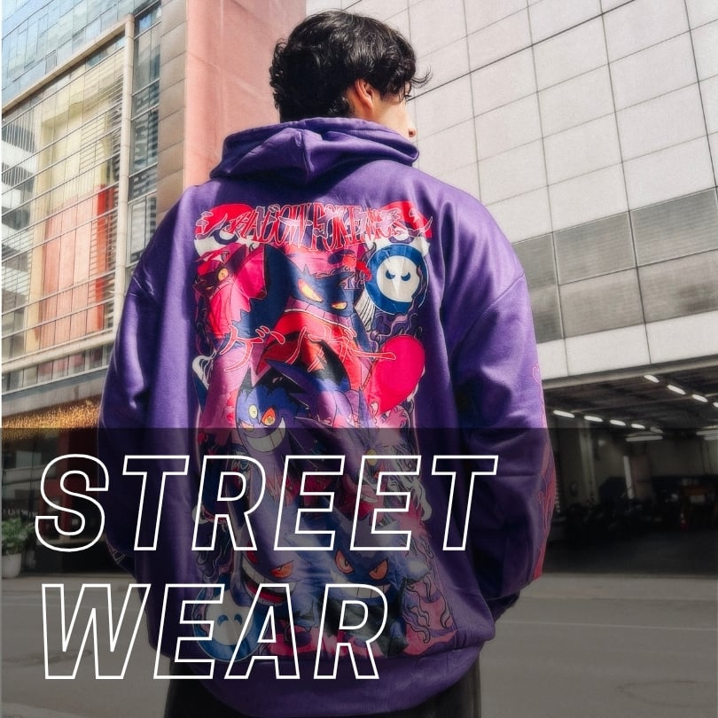 A person wearing a purple hoodie featuring Pokémon Gengar graphics, with the words STREET WEAR overlaid in large white text.